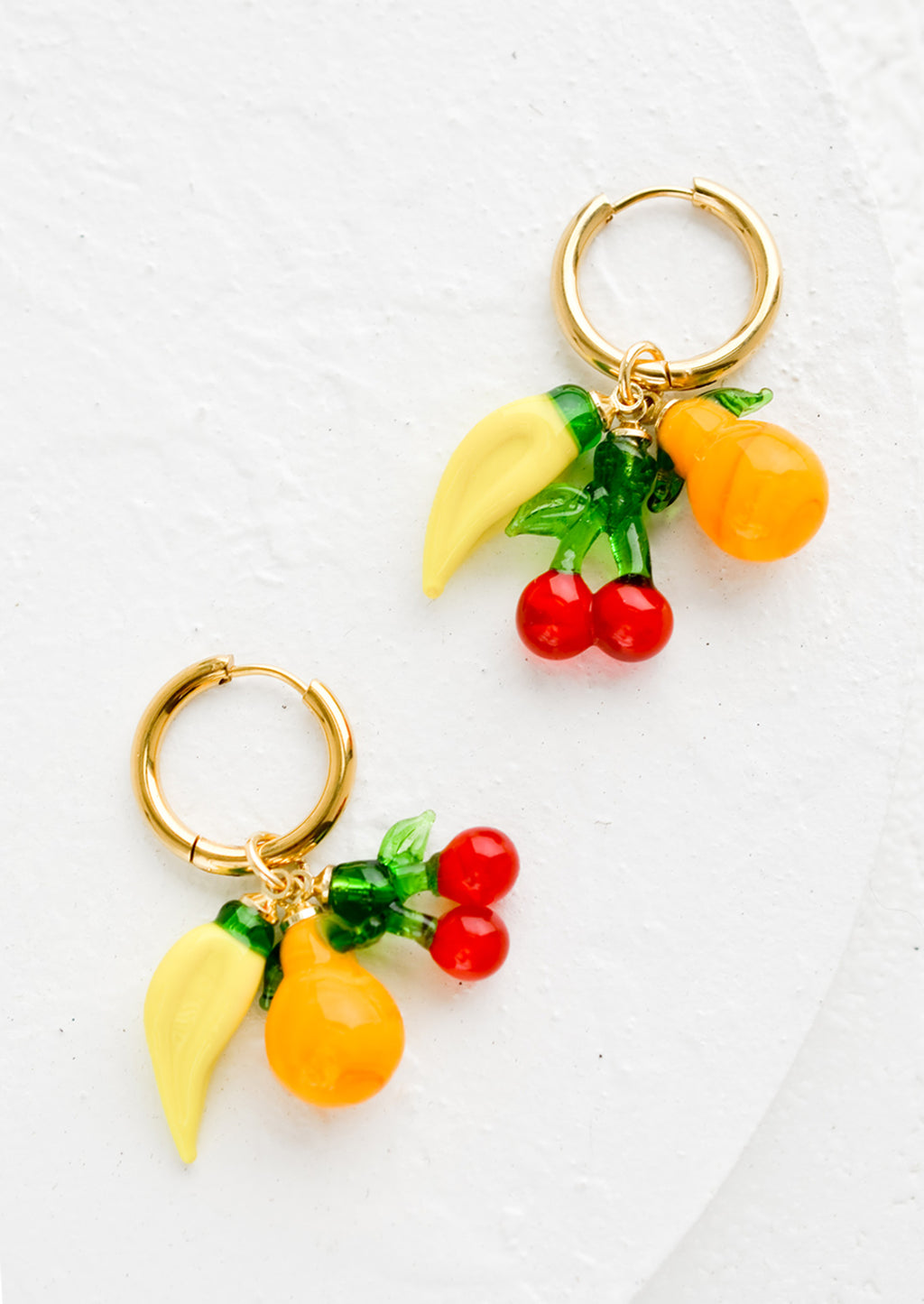 2: Gold hoop earrings with glass banana, cherry and orange fruit charms.