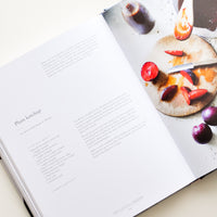 4: A cookbook opened to a recipe for plum ketchup.