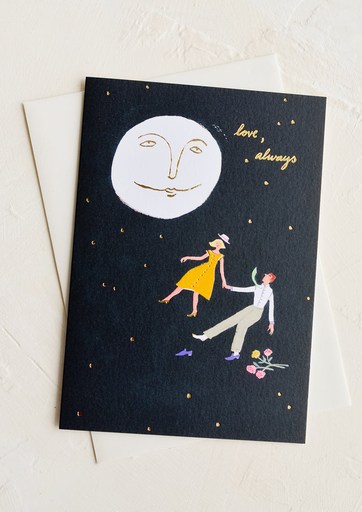 1: A greeting card with image of couple and moon, text reads "love, always".