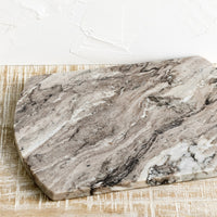 1: a rectangular marble serving board with rounded sides