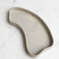 Medium / Grey: An asymmetrical medium sized ceramic tray in textured gray.