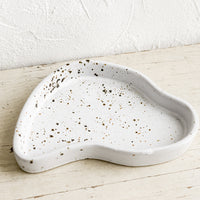Small / Speckled: An asymmetrical small ceramic tray in white glaze with brown speckles.