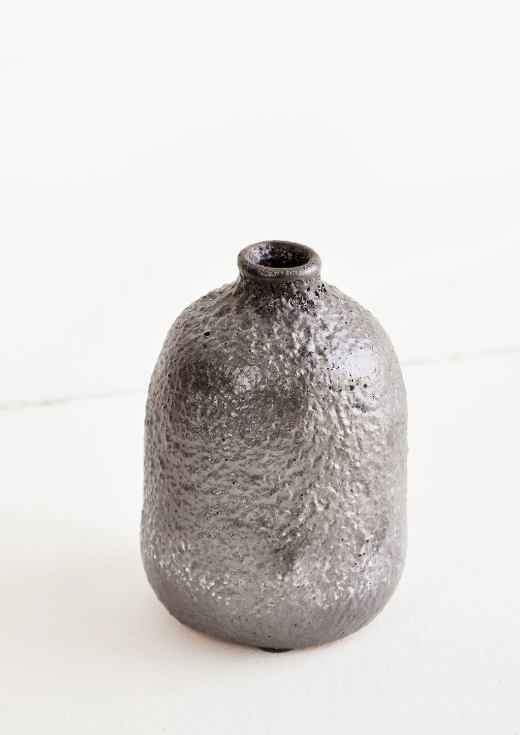 Medium / Mercury: Heavily textured, midsize ceramic bud vase in a metallic, crater-like dark grey glaze - LEIF