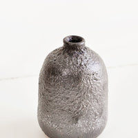 Medium / Mercury: Heavily textured, midsize ceramic bud vase in a metallic, crater-like dark grey glaze - LEIF