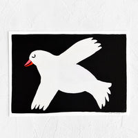 1: Art print with black background and cartoon-inspired white dove illustration