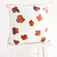 1: Square Throw Pillow in White with Copper Abstract Flower Print on Front