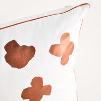3: Close up of copper trim detail on Square Throw Pillow in White with Copper Abstract Flower Print on Front