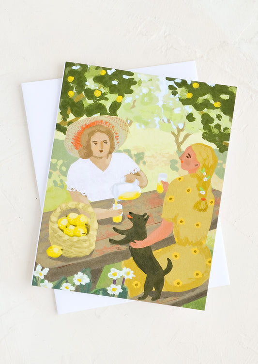 A greeting card with painting of two women at table drinking lemonade.