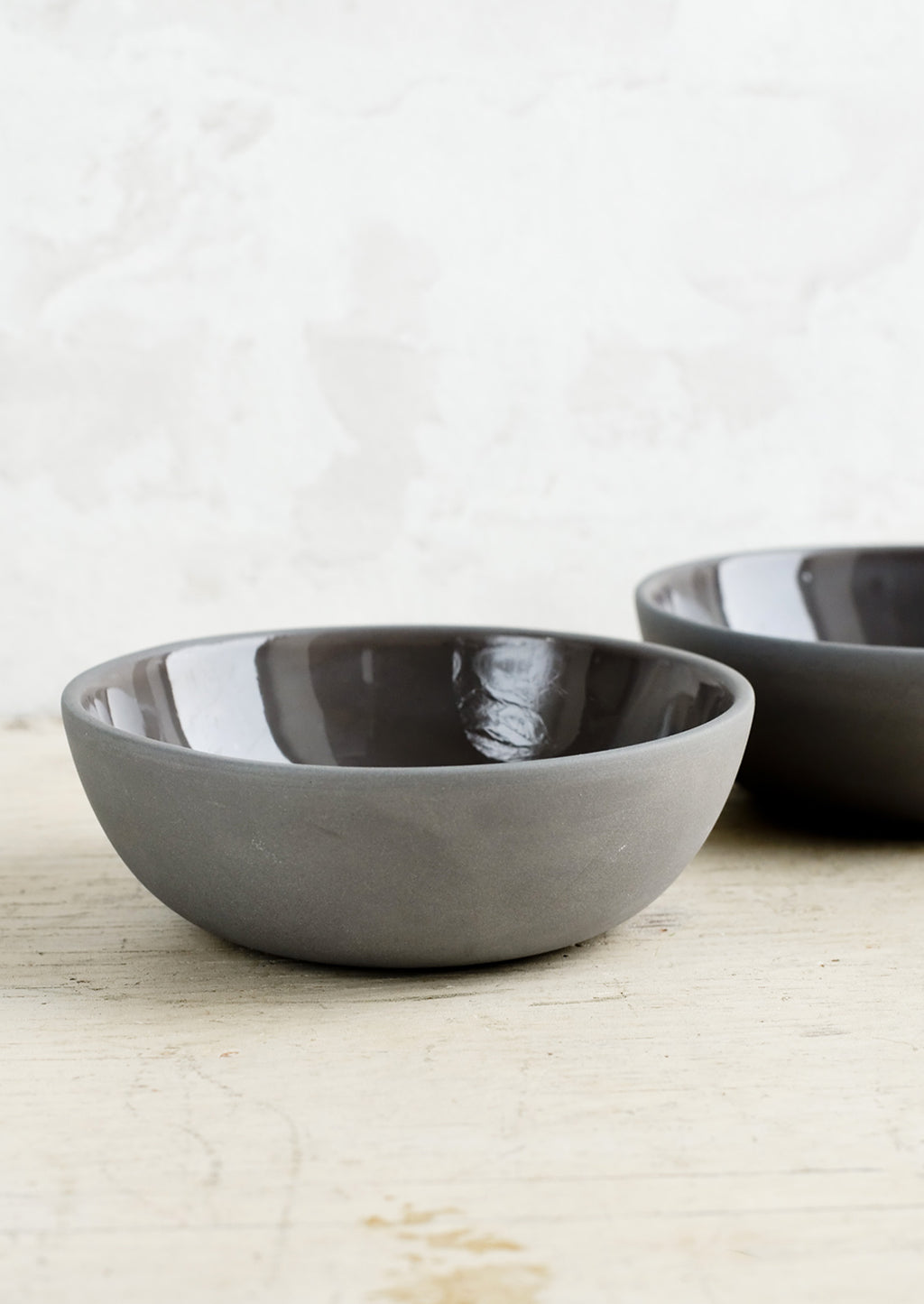 Charcoal: Matte porcelain bowls in charcoal hue with glossy interior.