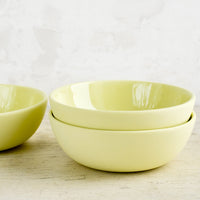 Citron: Matte porcelain bowls in citron yellow hue with glossy interior.