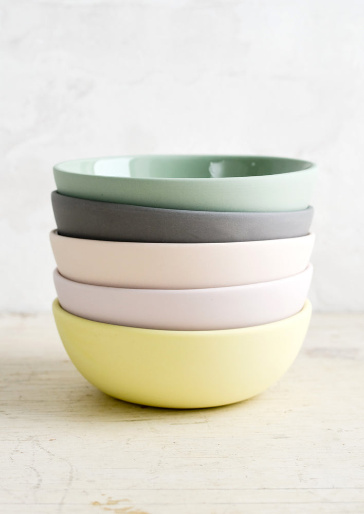 7: A stack of bowls with matte exterior and glossy interior in assorted pastel hues.
