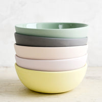 7: A stack of bowls with matte exterior and glossy interior in assorted pastel hues.