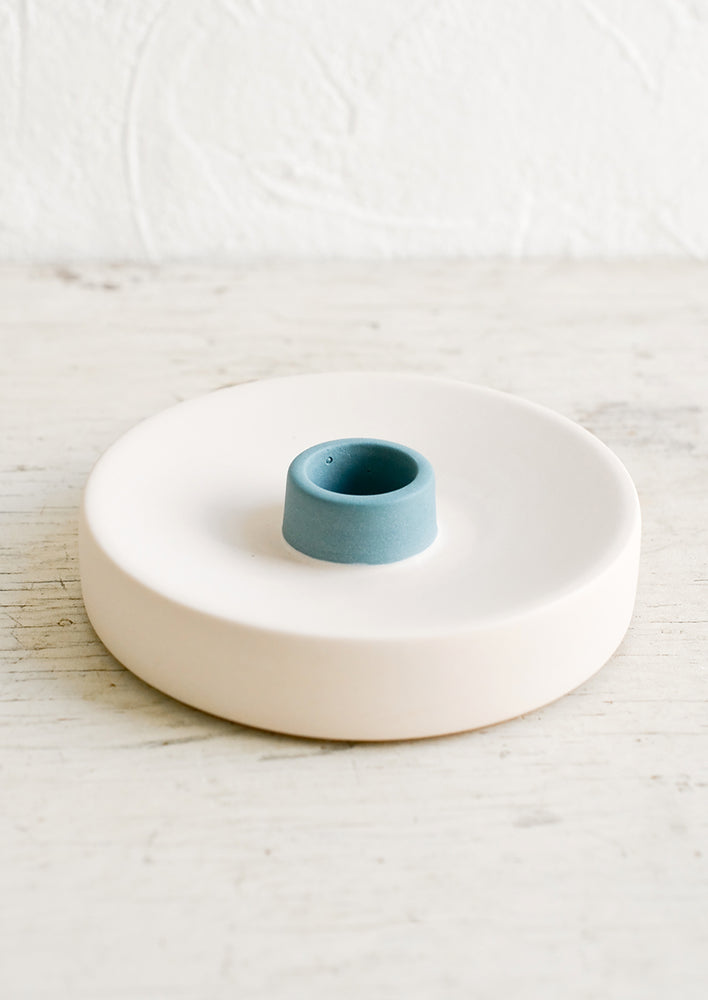 Single / Bisque / Teal: A round ceramic taper candle holder in nude and blue.