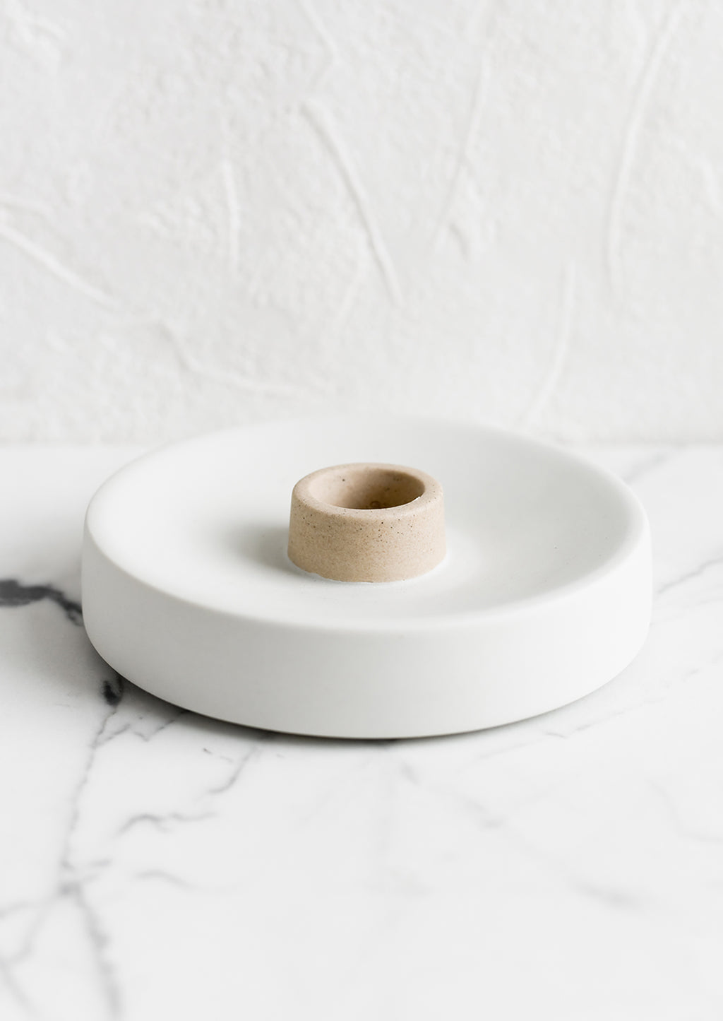 Single / White / Sand: A round ceramic taper candle holder in white and sand.
