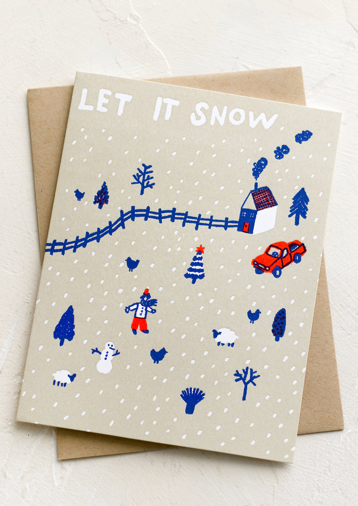 1: A greeting card with drawing of snowy village, text reads "Let it Snow".