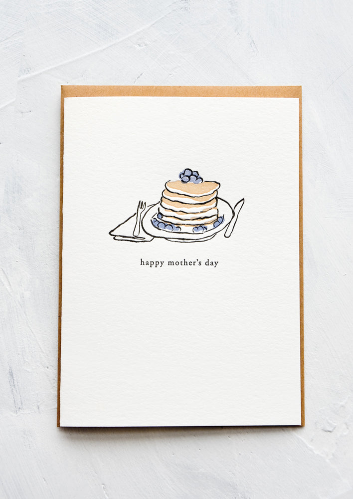 1: A letterpress printed greeting card with an image of blueberry pancakes stacked on a plate. Text below image reads "happy mother's day".