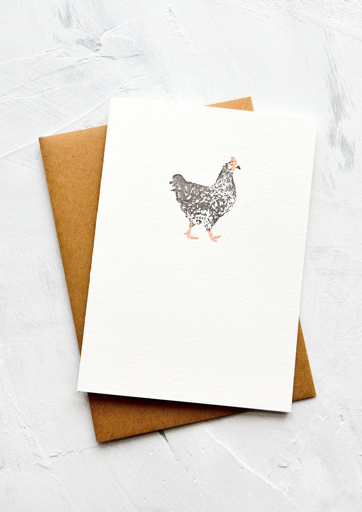 A letterpress printed greeting card with an image of a chicken