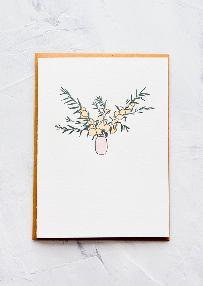A letterpress printed greeting card with an image of citrus branches in a pink vase