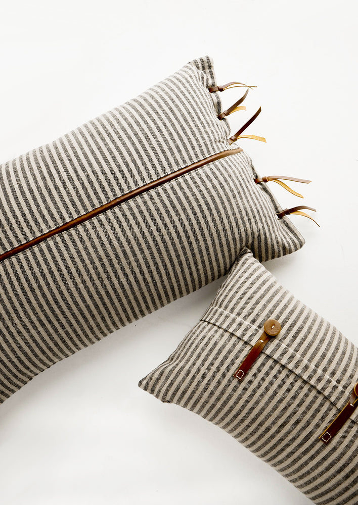 3: Lumbar throw pillows in tan and black striped fabric with brown leather details