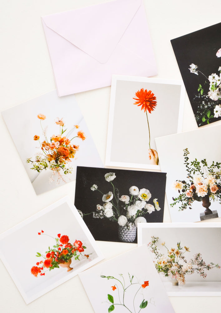 1: Product show showing multiple styles of floral photography notecards.