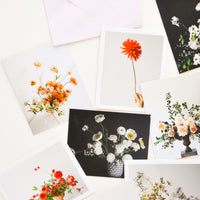 1: Product show showing multiple styles of floral photography notecards.