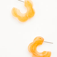 Apricot Candy: Acetate earrings in the shape of a daisy-like flower, marbled translucent apricot color