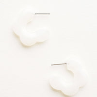 Cotton Blossom: Acetate earrings in the shape of a daisy-like flower, marbled translucent white color
