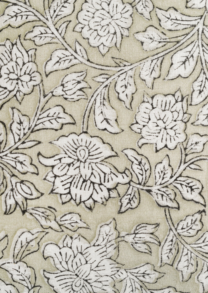 Block printed fabric with greige floral print.