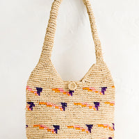 Pink / Orange Multi: A hobo tote made from natural raffia with pink, purple and orange detailing.
