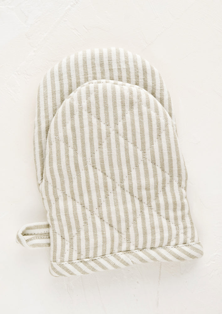 Tan / White: A quilted oven mitt made from tan and ivory striped linen.