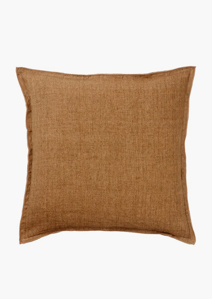 A solid linen pillow in pecan brown.