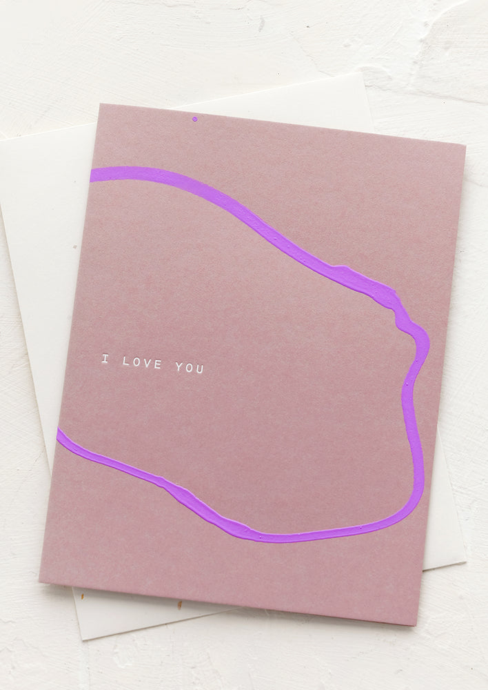 A greeting card with abstract squiggle and text reading "I Love You".