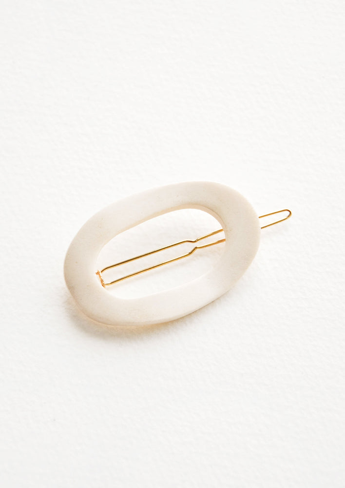 Bleached Ivory: Oval shaped hair clip made out of white wood with gold clasp