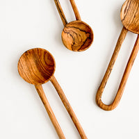 1: Wooden spoons in decorative grained olivewood, with hollow loop-shaped handles