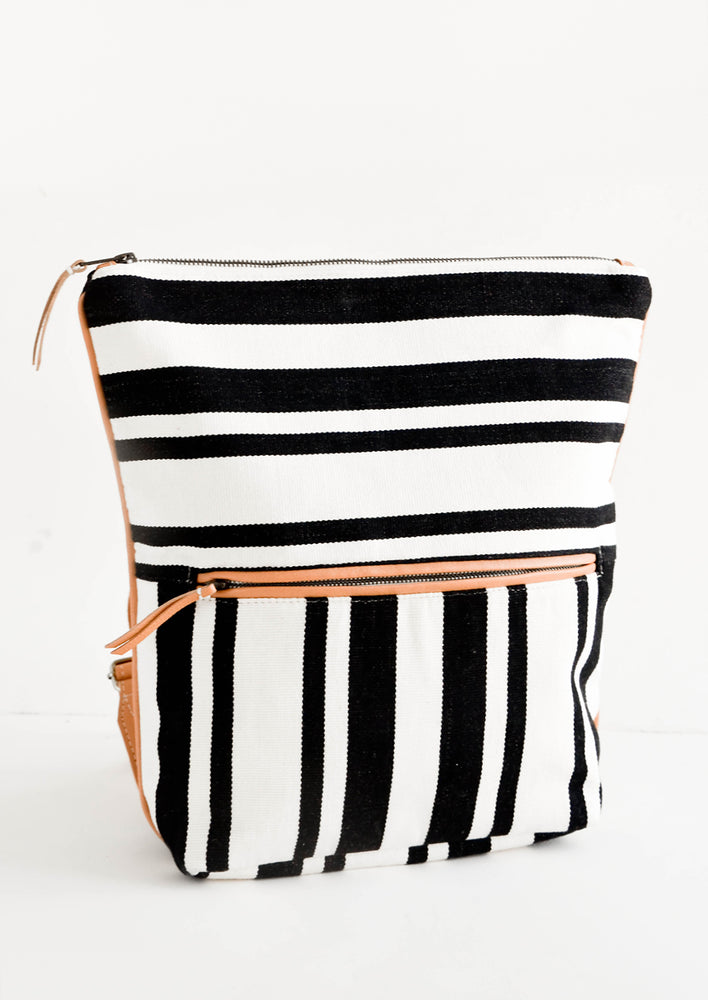 Fashion backpack in black and white striped cotton canvas with tan leather accents