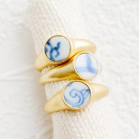 3: Gold signet rings with blue and white pottery signet.