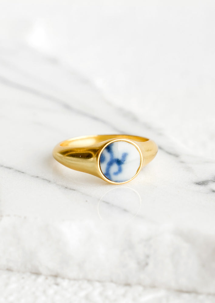1: Gold signet ring with blue and white pottery signet.