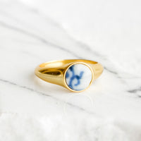 1: Gold signet ring with blue and white pottery signet.