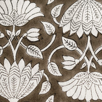 2: A dark brown and white lotus print block print pattern.