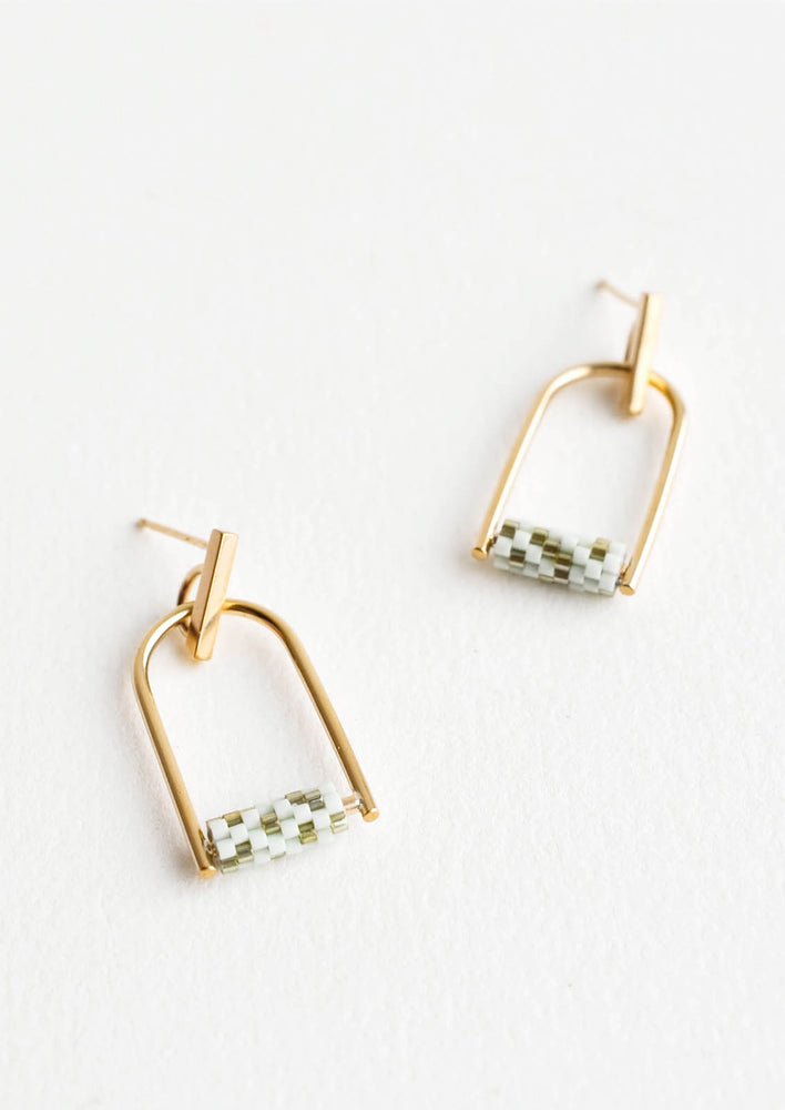 Arced gold post back earrings with mint and olive green beads closing off the arc.