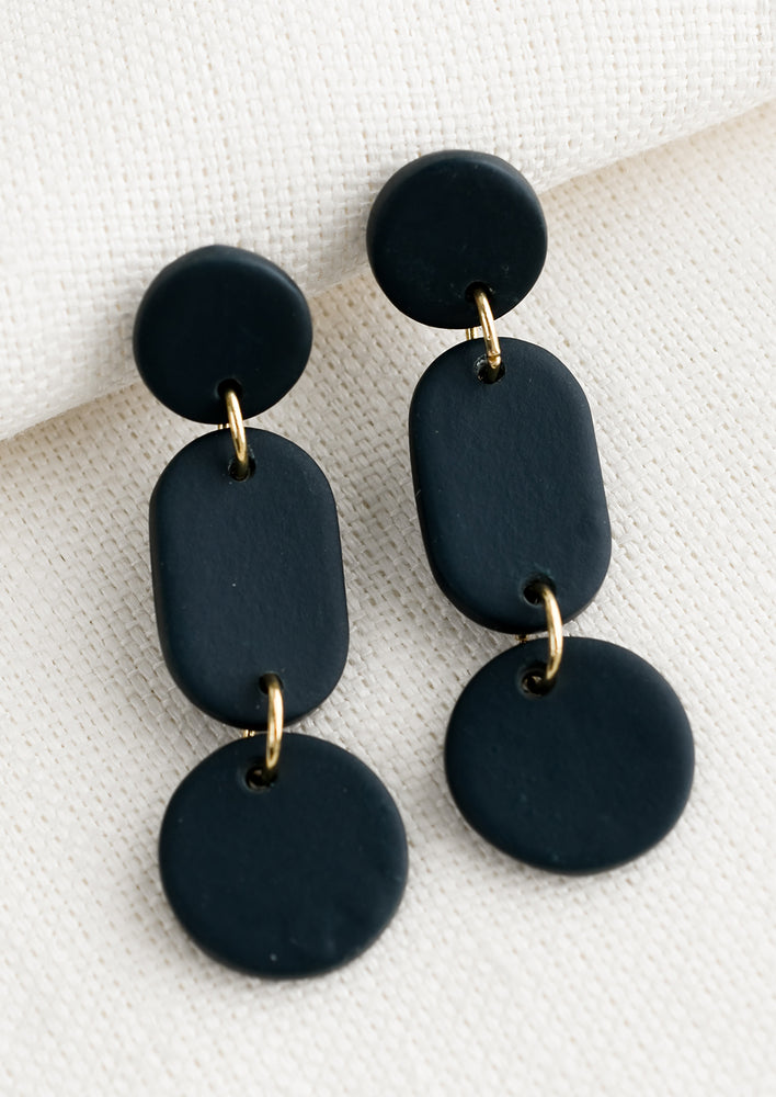 Midnight Blue: A pair of earrings in three part geometric design in midnight blue.