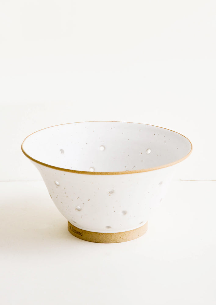 Ceramic colander in white ceramic with raw clay accents