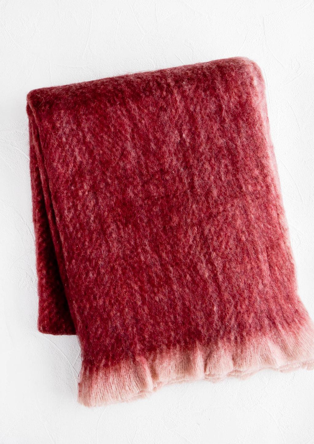 2: Fuzzy, mohair-like throw blanket in wine red with faded fringe trim