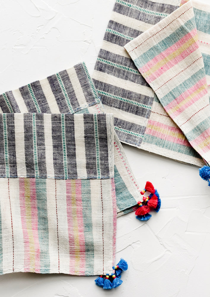 1: A pair of khadi cotton madras napkins with tassel detailing.