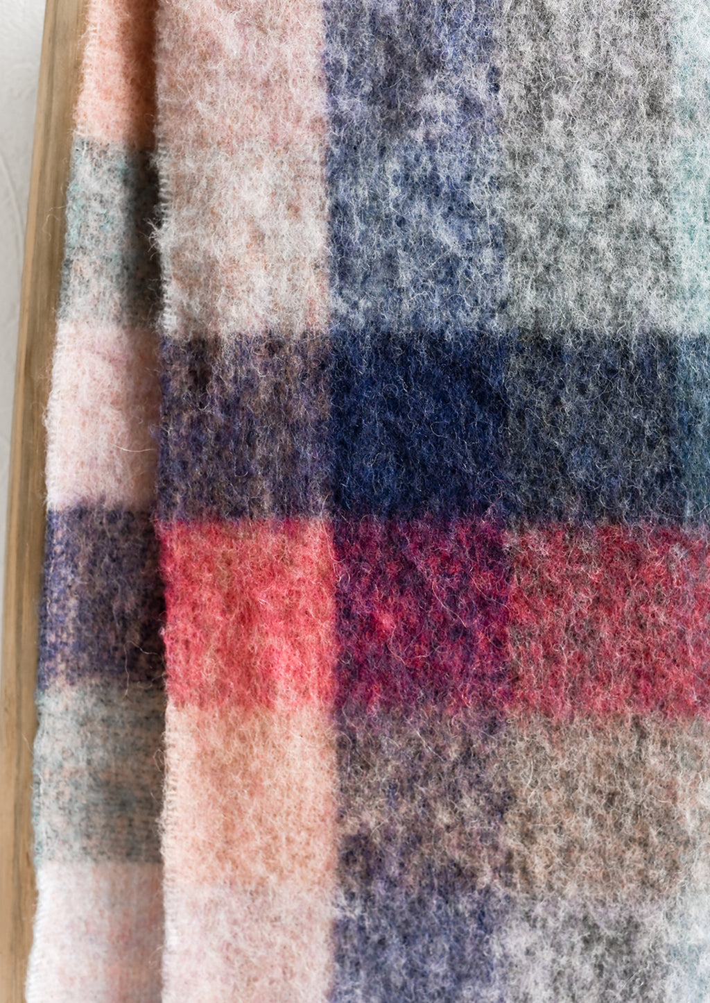 3: A fuzzy woven wool scarf in pastel madras pattern.