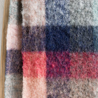 3: A fuzzy woven wool scarf in pastel madras pattern.
