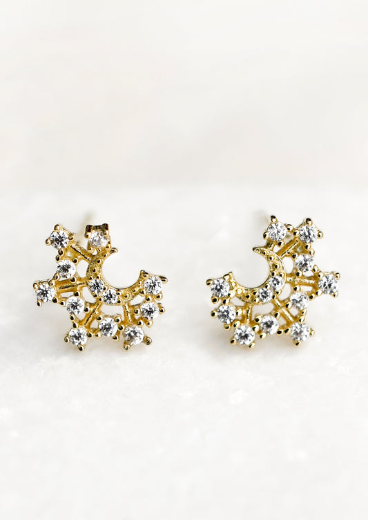 Crystal moon shaped gold stud earrings.