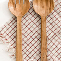 1: A pair of acacia wood salad servers with simple, plain design.