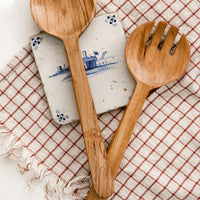 3: A pair of acacia wood salad servers with simple, plain design.