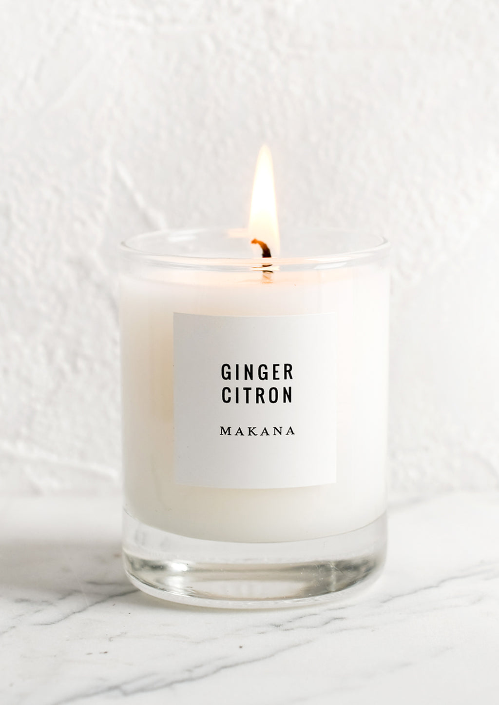 Ginger Citron: A votive candle in glass container.